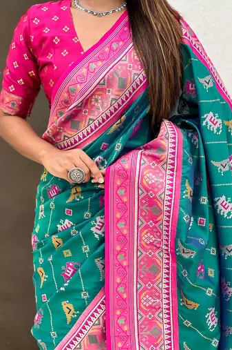 Teal green woven self design silk blend patola saree with blouse