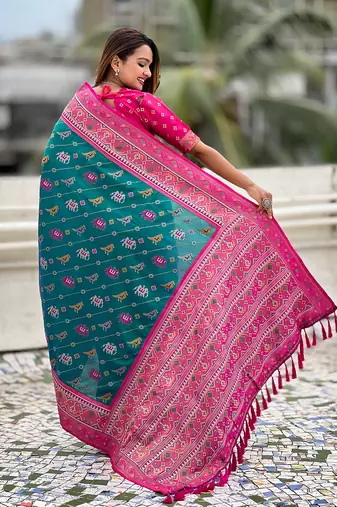 Teal green woven self design silk blend patola saree with blouse