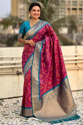 Magenta woven self design silk blend patola saree with blouse