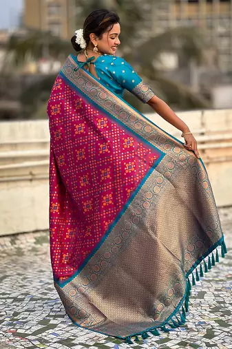 Magenta woven self design silk blend patola saree with blouse