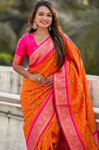 Orange woven self design silk blend patola saree with blouse