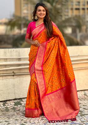 Orange woven self design silk blend patola saree with blouse 3