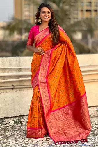 Orange woven self design silk blend patola saree with blouse