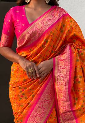 Orange woven self design silk blend patola saree with blouse 4