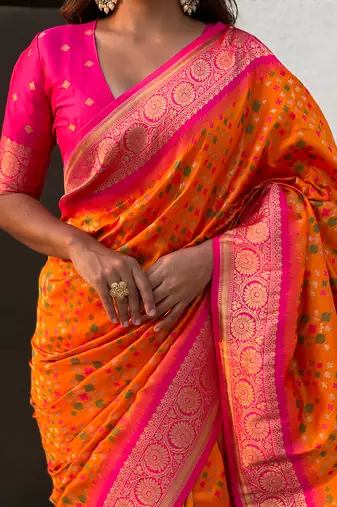 Orange woven self design silk blend patola saree with blouse