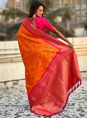 Orange woven self design silk blend patola saree with blouse 5