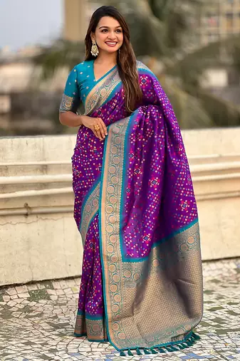 Purple woven self design silk blend patola saree with blouse