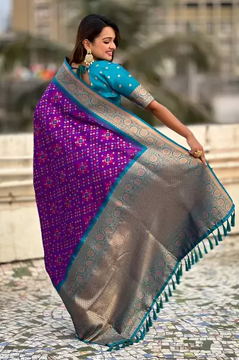 Purple woven self design silk blend patola saree with blouse