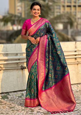 Teal green woven self design silk blend patola saree with blouse 1