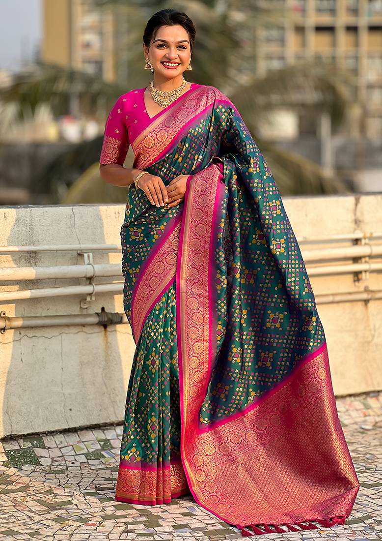 Teal green woven self design silk blend patola saree with blouse