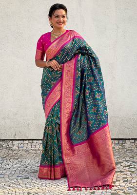 Teal green woven self design silk blend patola saree with blouse 2