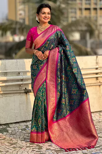 Teal green woven self design silk blend patola saree with blouse