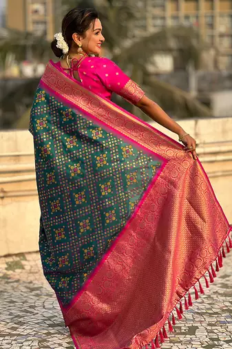 Teal green woven self design silk blend patola saree with blouse