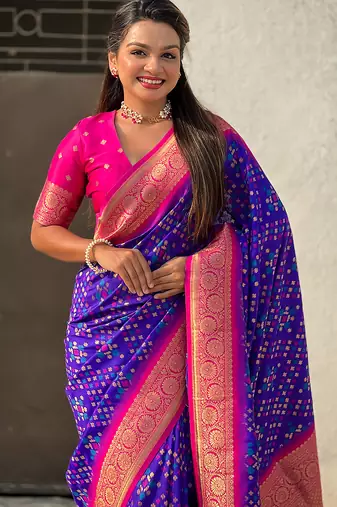 Violet woven self design silk blend patola saree with blouse