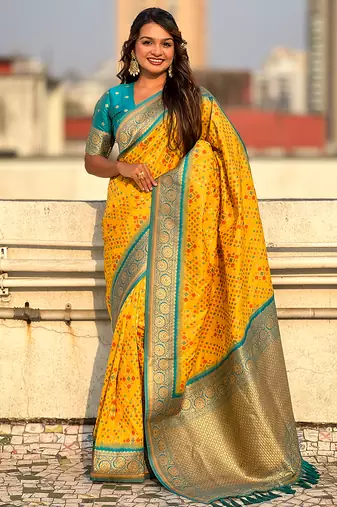 Yellow woven self design silk blend patola saree with blouse