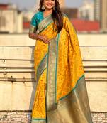 Yellow woven self design silk blend patola saree with blouse