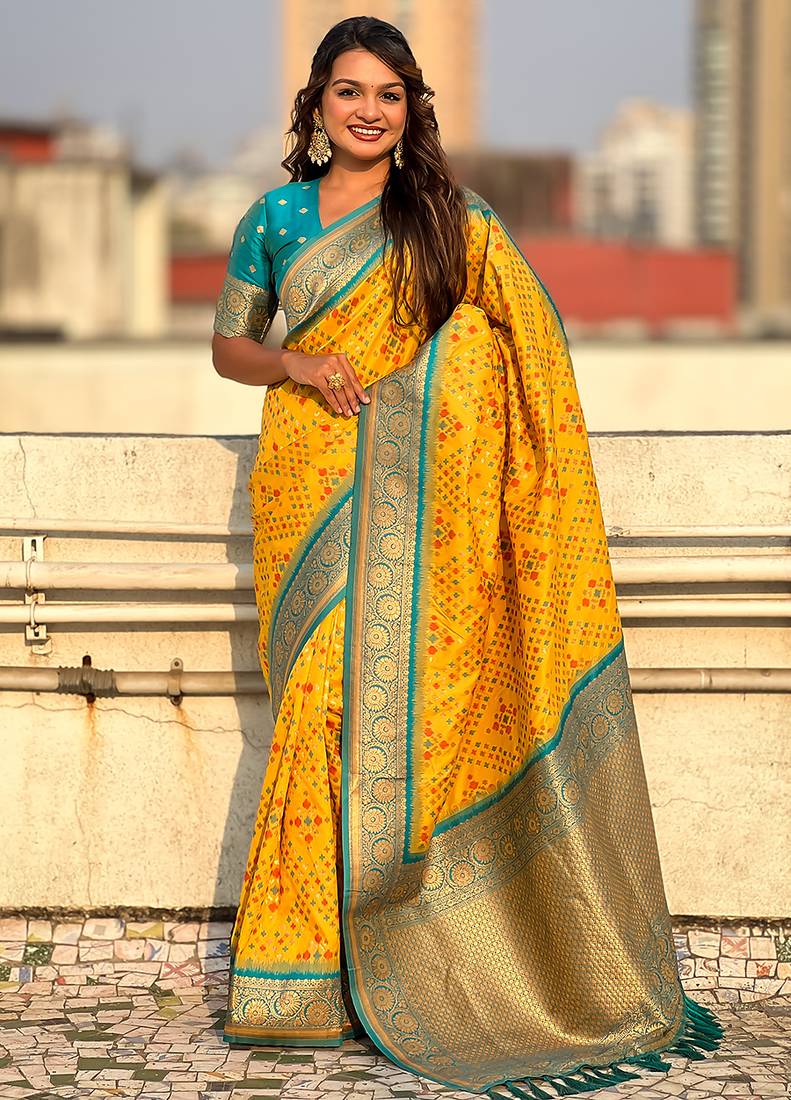 Yellow woven self design silk blend patola saree with blouse