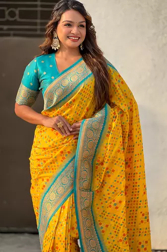 Yellow woven self design silk blend patola saree with blouse