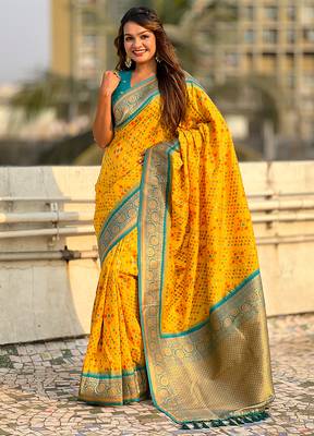 Yellow woven self design silk blend patola saree with blouse 3