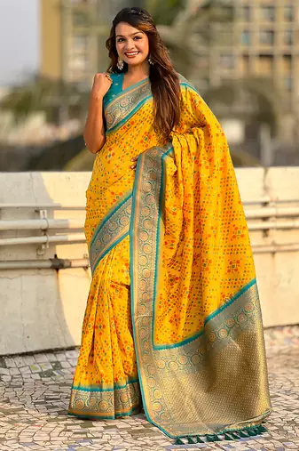 Yellow woven self design silk blend patola saree with blouse