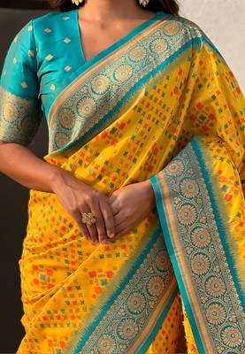 Yellow woven self design silk blend patola saree with blouse 4