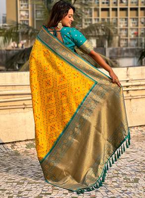 Yellow woven self design silk blend patola saree with blouse 5