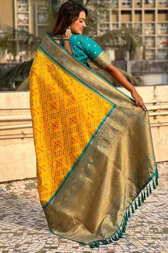 Yellow woven self design silk blend patola saree with blouse