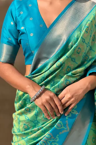 Pista green woven self design silk blend patola saree with blouse