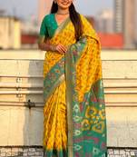 Yellow woven self design silk blend patola saree with blouse