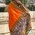 Orange woven self design tissue silk blend patola saree with blouse