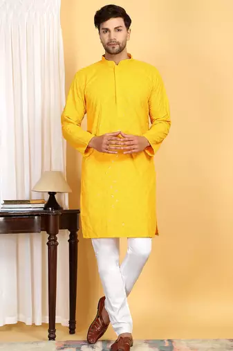 Yellow embroidered kurta set with sequins highlights