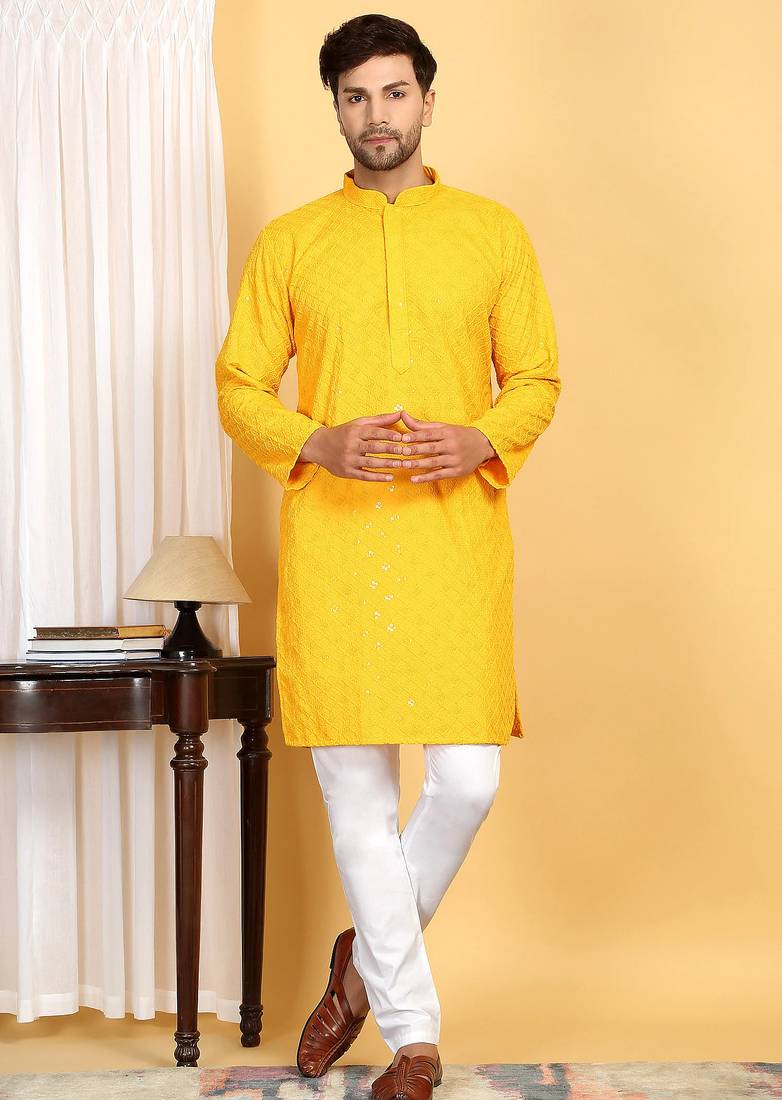 Yellow embroidered kurta set with sequins highlights