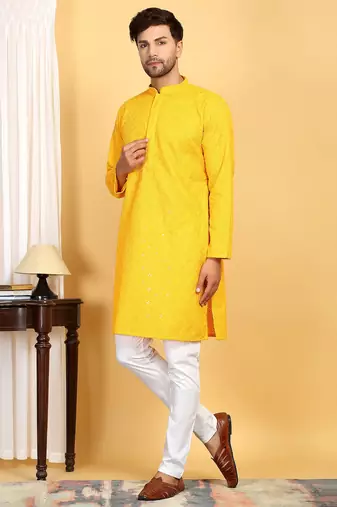Yellow embroidered kurta set with sequins highlights