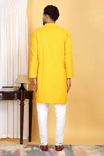 Yellow embroidered kurta set with sequins highlights