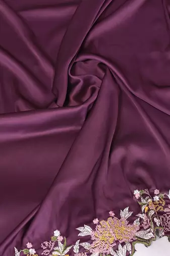 Purple soft satin saree with embroidered border and matching blouse piece