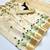 Cream tissue kerala kasavu saree with floral embroidery design