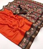 Orange spice silk saree with zari border, check design & floral pallu