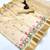 Cream kerala kasavu tissue saree with floral embroidery & zari border