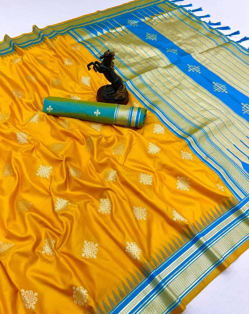 Yellow soft silk saree with kolam zari motifs & designer pallu