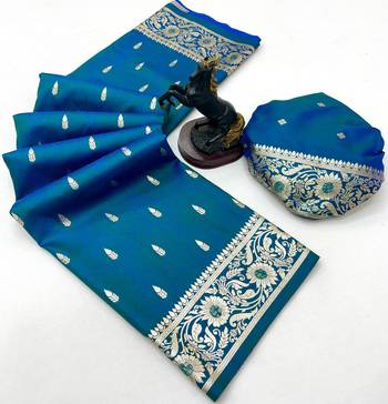 Teal banarasi silk saree with embossed weaving design 2