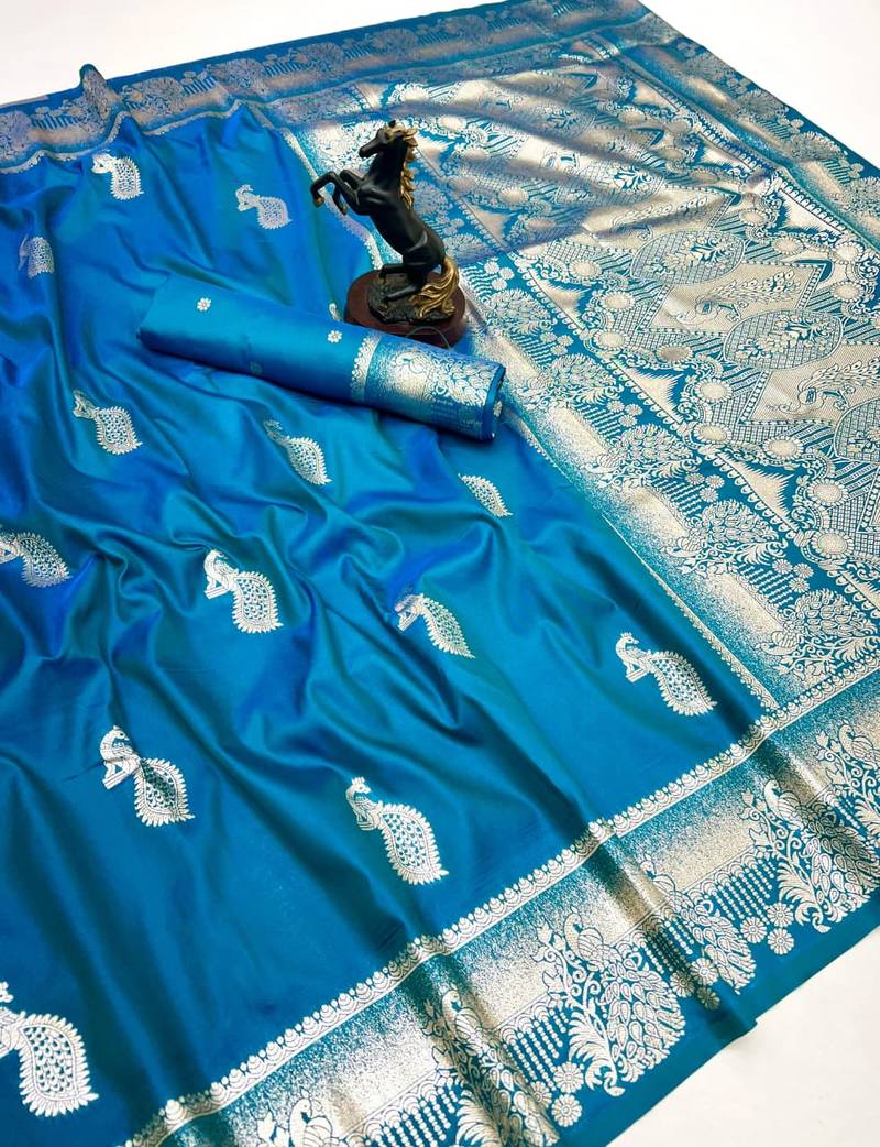 Sky blue banarasi silk saree with zari embossed peacock design
