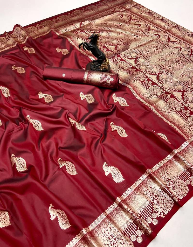 Maroon banarasi silk saree with zari embossed peacock design