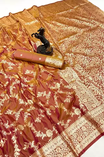 Rust banarasi silk saree with zari embossed jal design & rich pallu