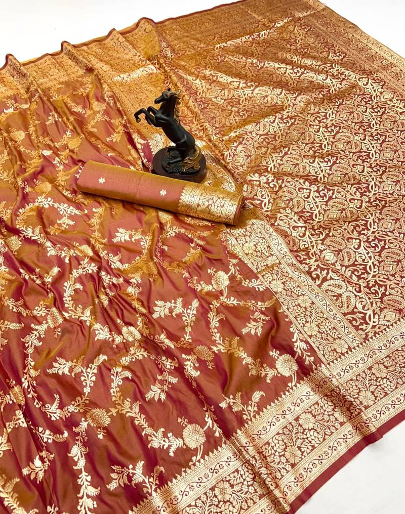 Rust banarasi silk saree with zari embossed jal design & rich pallu