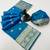 Sky blue banarasi silk saree with zari embossed jal design & rich pallu