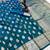 Teal banarasi silk saree with zari embossed mango design & rich pallu