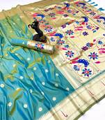 Light green soft silk paithani saree with flora zari weaving & muniya border