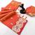 Orange soft silk saree with butti design & floral zari border