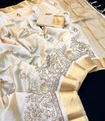 Cream tussar silk saree with kalamkari design & embroidery work