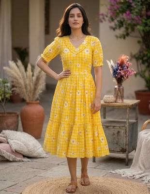 Yellow muslin silk printed checked fit and flared dresses 1